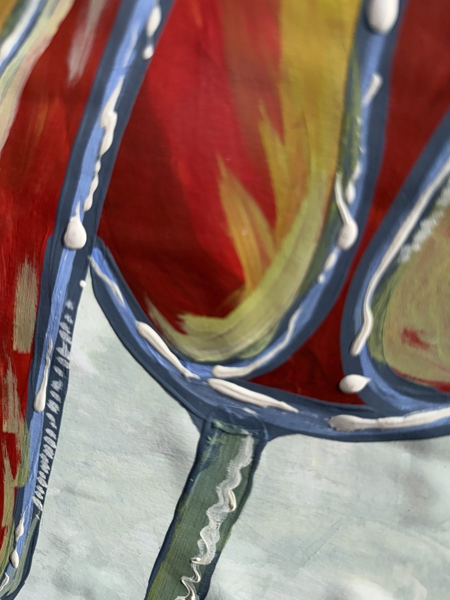 Close-up of The Neighborhood Tulips: red petals edged in navy and cornflower blue, with raised white paint beading along the lines
